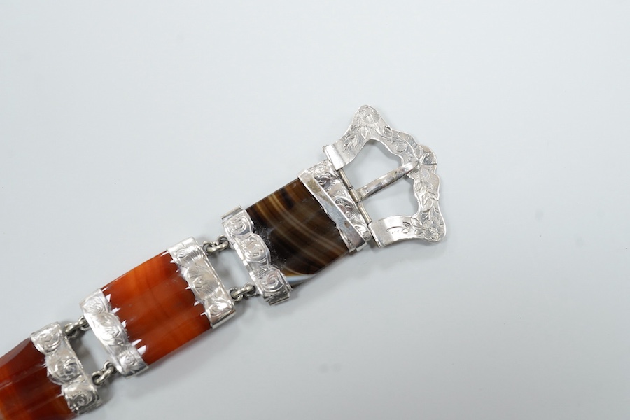 A Victorian Scottish engraved white metal and banded agate set bracelet, with buckle clasp, overall length 21.8cm.